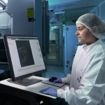 Researcher at a computer screen at the Australian Organoid Facility