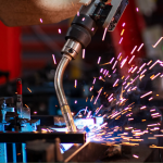 Close up of robot arm welding reddish