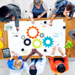 Overhead view of students around a desk