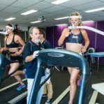 Researcher and participant at sport exercise equipment