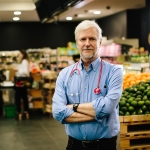 Researcher in front of fruit and vegetables
