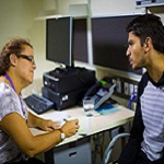 Researcher from QCMHR interviewing a client