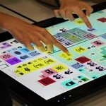 Two hands playing Engage Research Lab Serious Urban Play online game