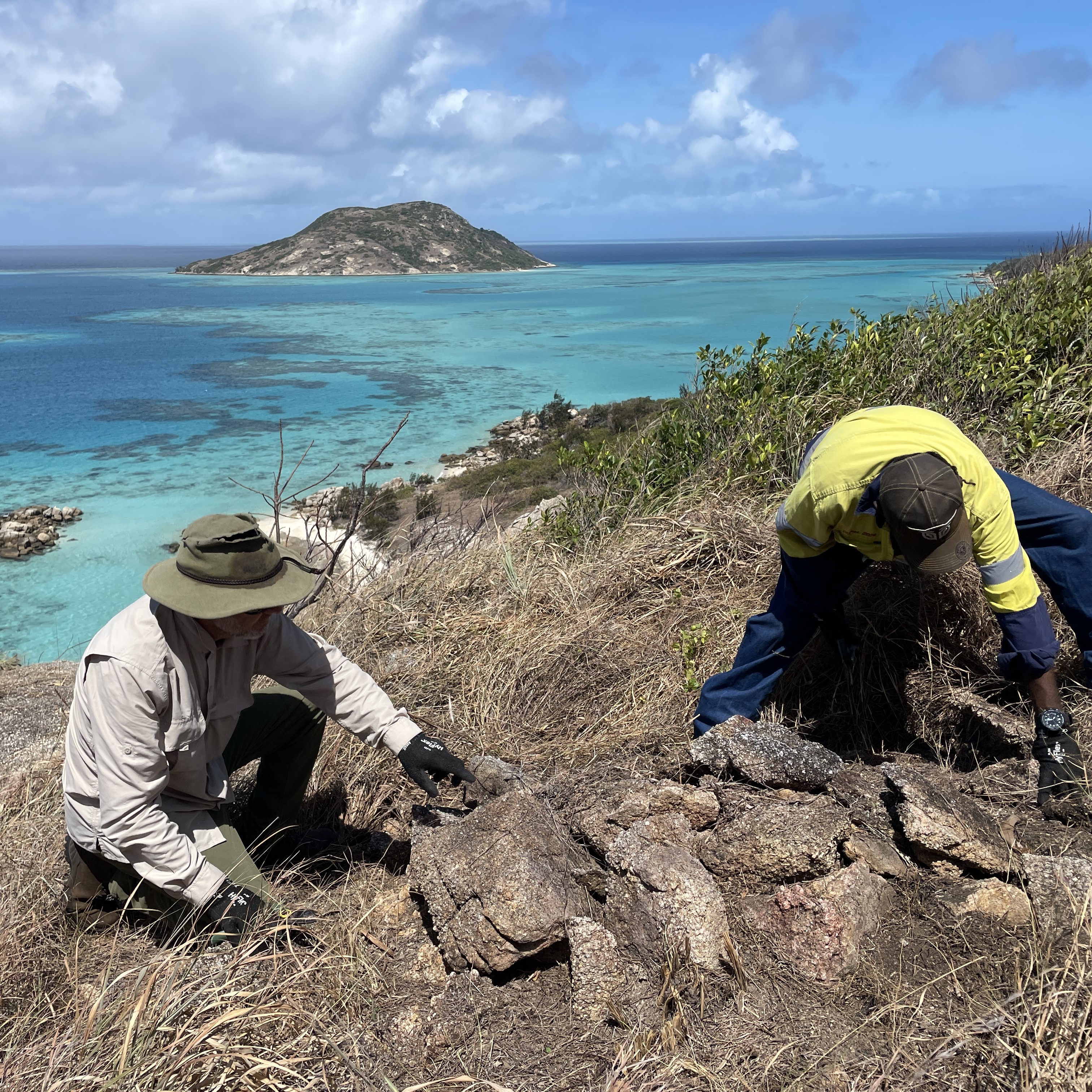 A researcher and Traditional Owner look after an ancient stone arrangement on Jiigurru Island