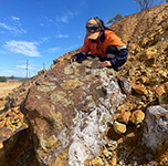 BRC researcher sampling mine waste on site