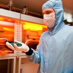 Researcher in fabrication clean room